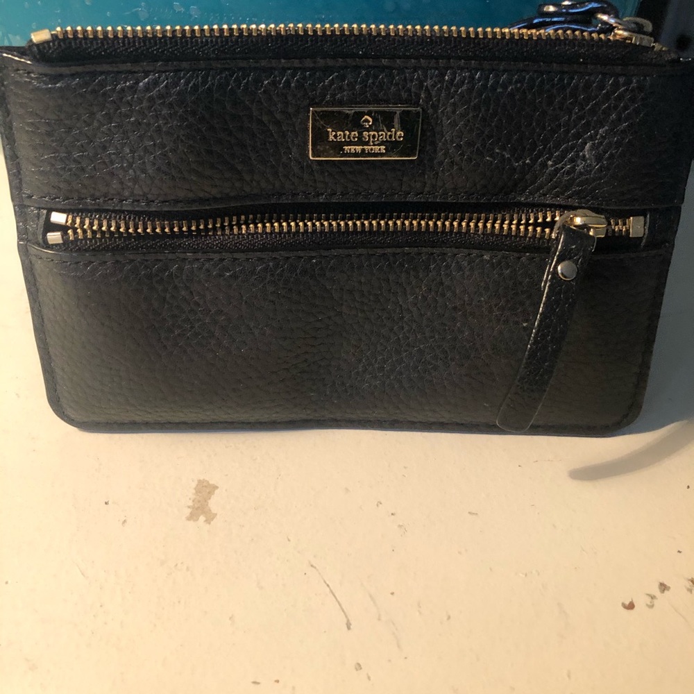 Kate Spade wristlet with one zipper pocket